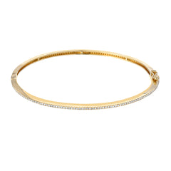 simple diamond bangle in yellow gold