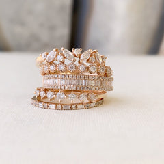 baguette and diamond halfway band stacked with other liven rings