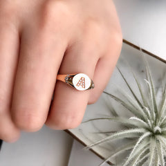 initial signet ring in "A" in 14k rose gold on hand