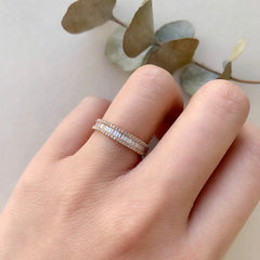 heirloom baguette diamond halfway band stacked with other liven rings