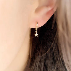 petite star huggies in yellow gold