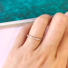 alternating baguette and round diamonds on a petite slender band