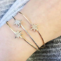 Starburst bangles on wrist