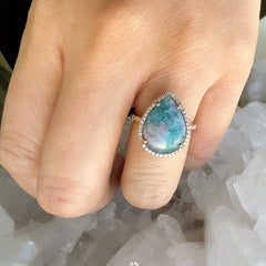 14k gold and diamond ring with a paraiba tourmaline center