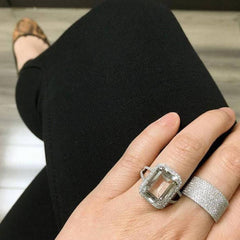 Emerald cut white topaz ring on hand