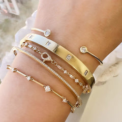 a rich selection of gold and diamond bracelets and cangles